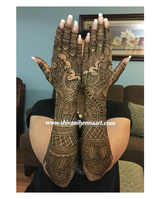 Unique Hook Art Blending Into Stylish Full Hand Mehndi Design